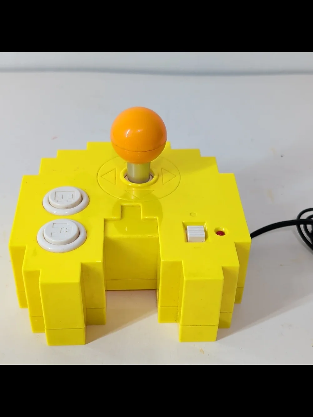Yellow Retro Arcade Joystick with Orange Ball Top